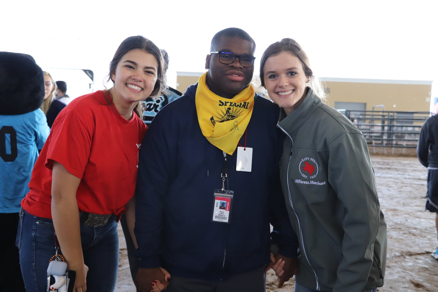 A life skills student poses with two student volunteers at the Katy Special Rodeo.